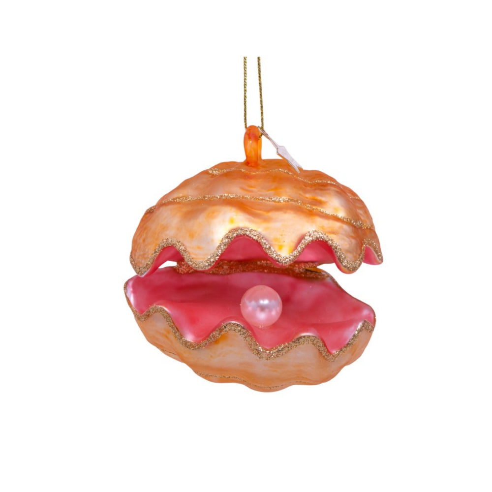 Glass ornament of an oyster with a pearl on a white background