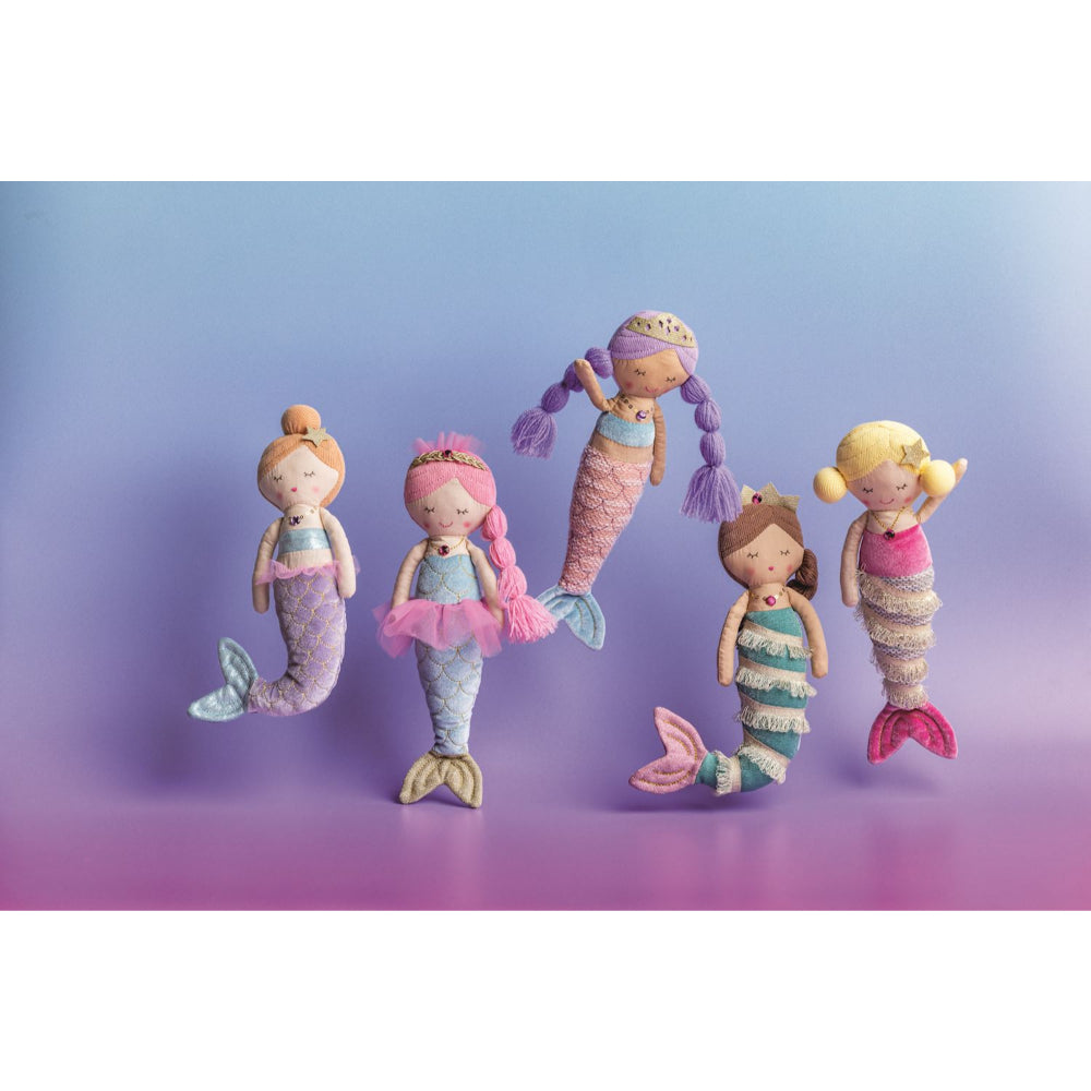 Five colorful mermaid dolls with different hairstyles on a gradient purple background.