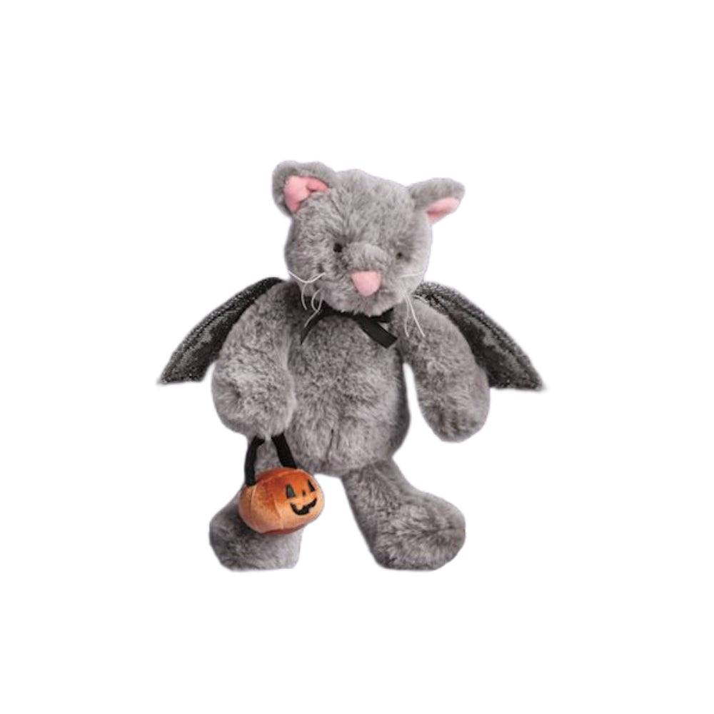 A gray plush cat toy dressed as a bat, with black wings, a pink nose and ears, and holding a small orange jack-o'-lantern bucket, shown on a plain white background.