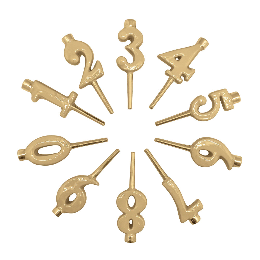 Set of ten gold-colored metal number cake toppers arranged in a circular pattern on a solid white background.