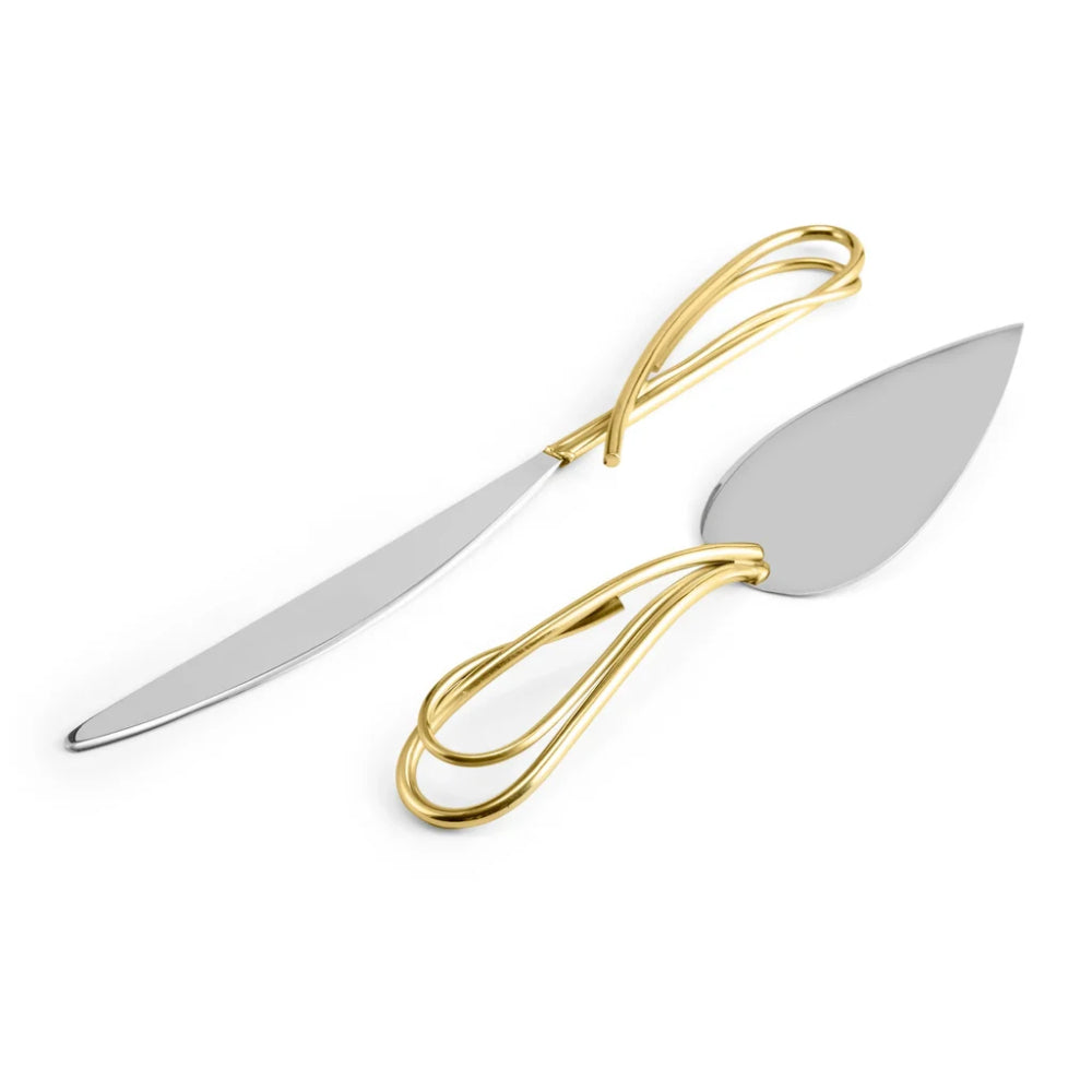 Two cake knives with gold handles on a white background