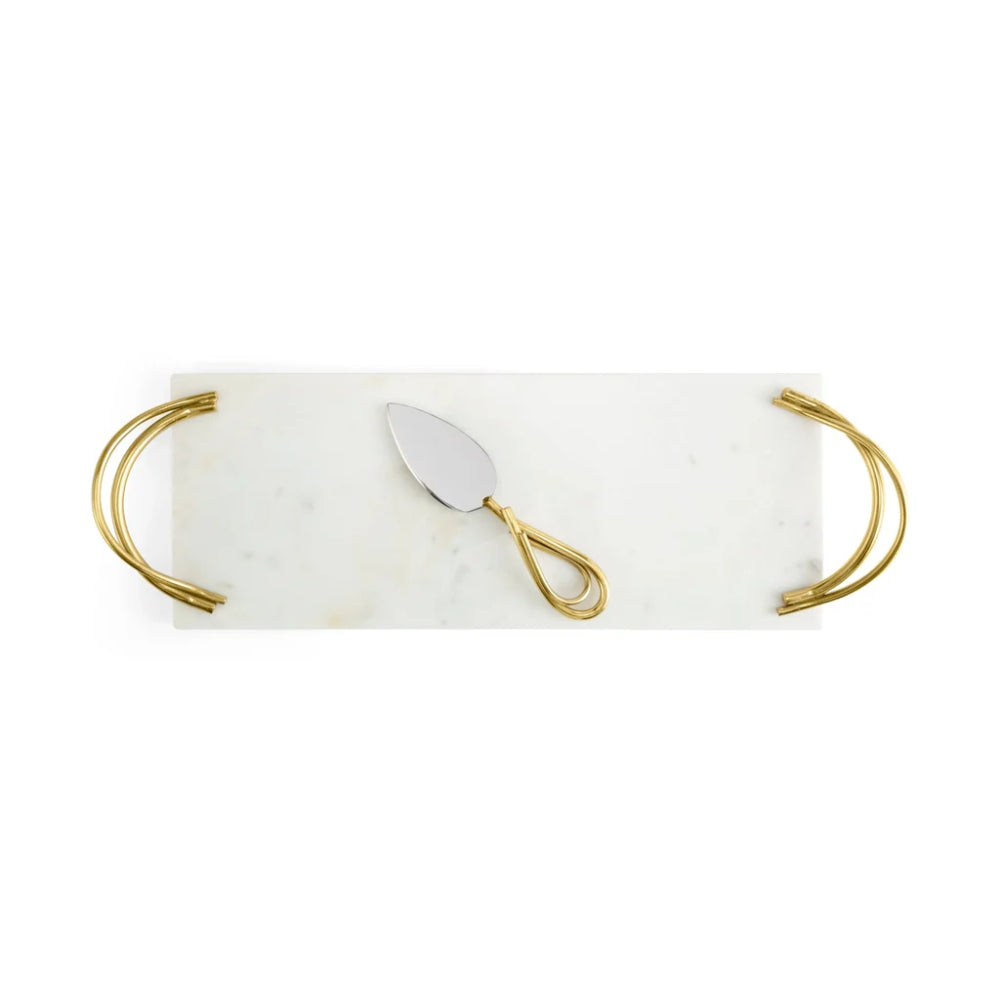 Marble tray with gold handles and a silver cake knife on a white background