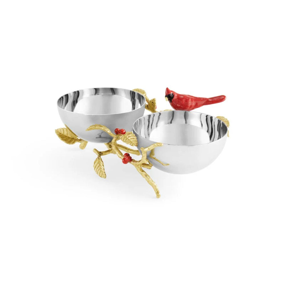 Decorative silver bowls with gold accents and red cardinal birds on a white background