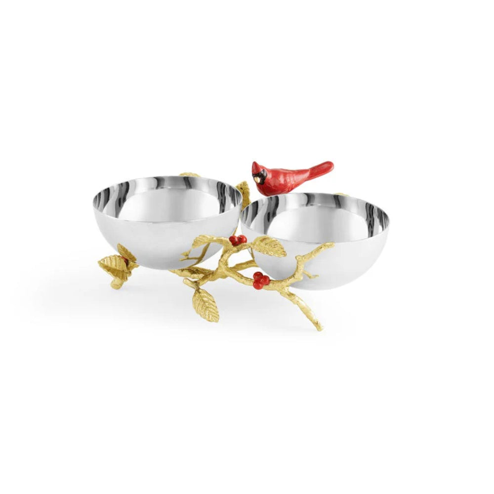 Decorative silver bowl with gold branch and red bird on a white background