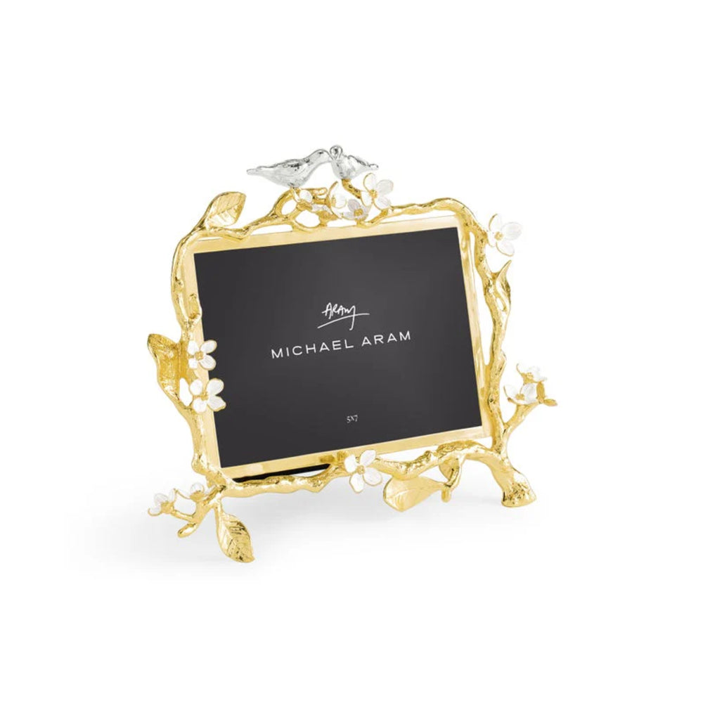 Gold photo frame with floral design on a white background