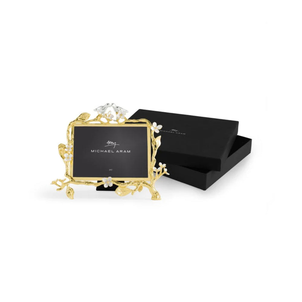 Gold photo frame with 'Michael Aram' branding on a white background