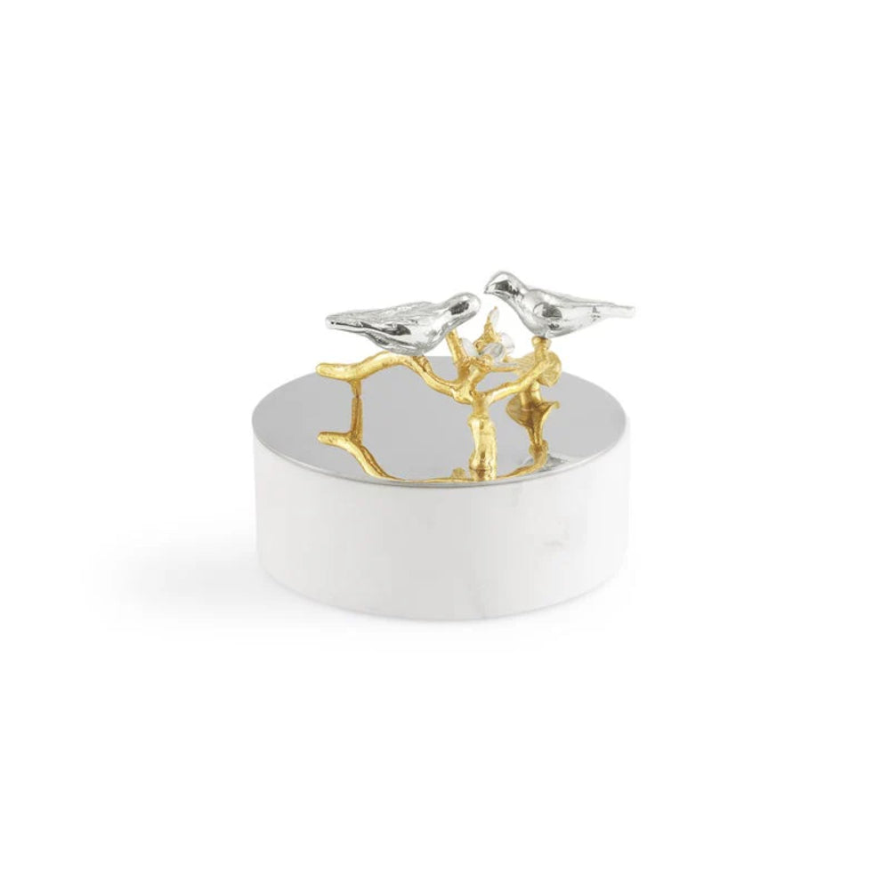 Decorative object with two birds on a branch on a white background.