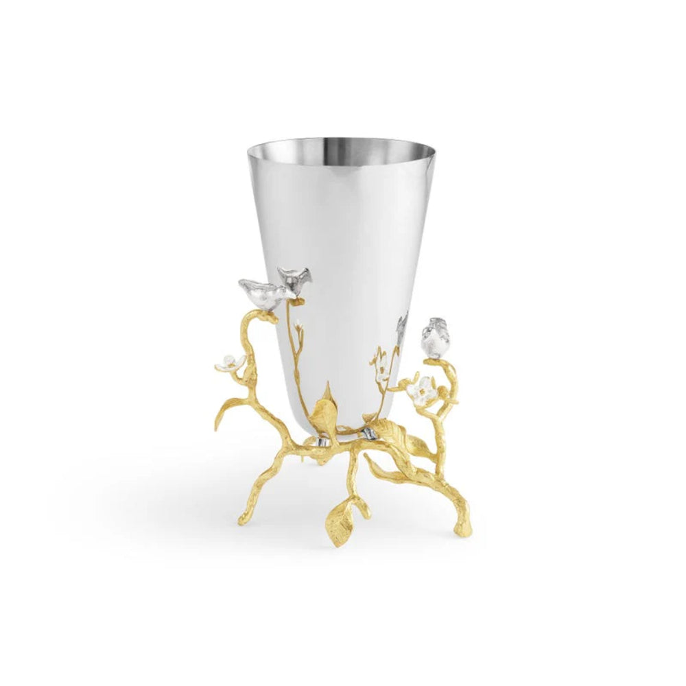 Decorative silver cup with gold base on a white background