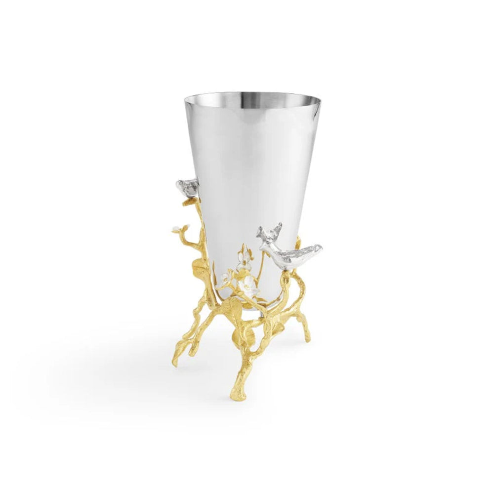 Decorative silver cup with gold stand on a white background