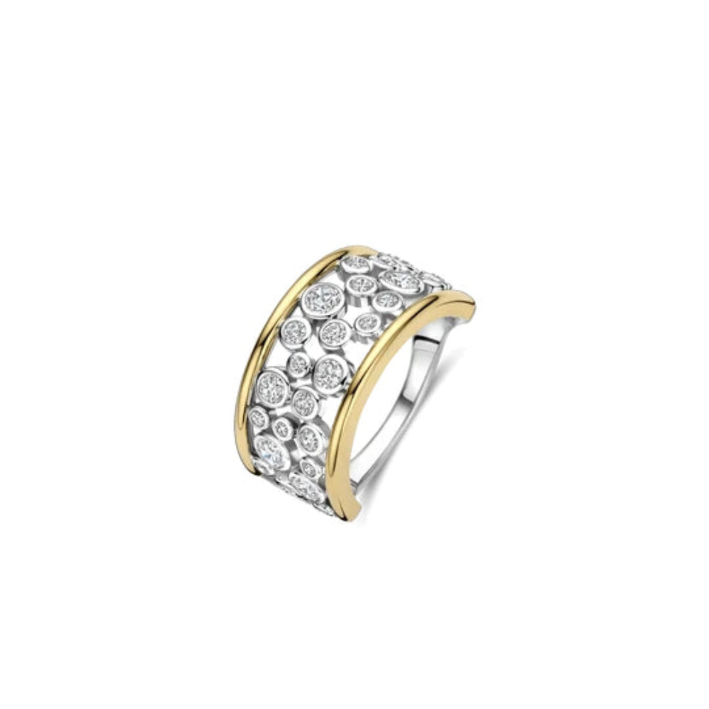 A two-tone curved ring featuring an open setting of clear round-cut stones on a yellow gold band, with a polished silver inner band