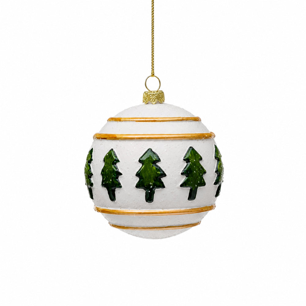 A white spherical Christmas ornament with a gold hanging loop and gold horizontal bands, decorated with green tree silhouettes, shown on a plain white background.