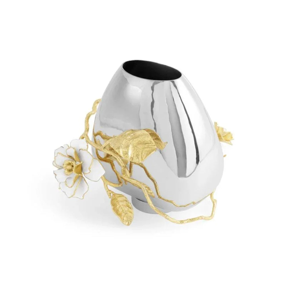 Silver vase with gold accents and flowers on a white background