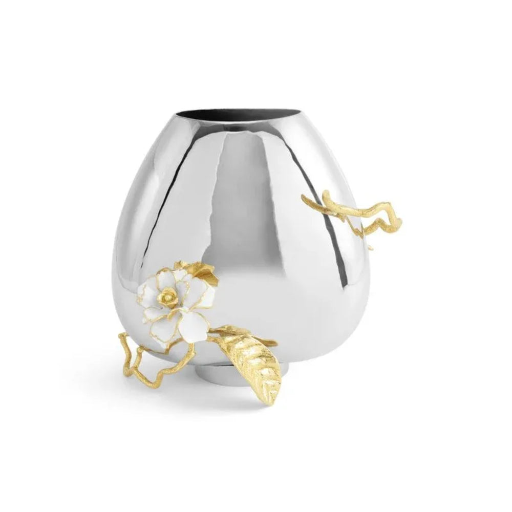 Silver vase with gold accents and floral designs on a white background