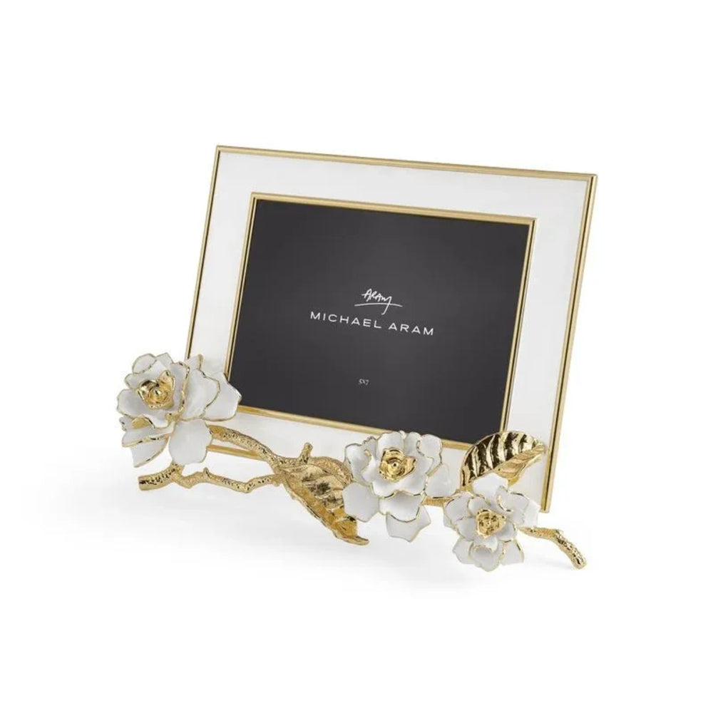 Decorative photo frame with floral design and gold accents on a white background