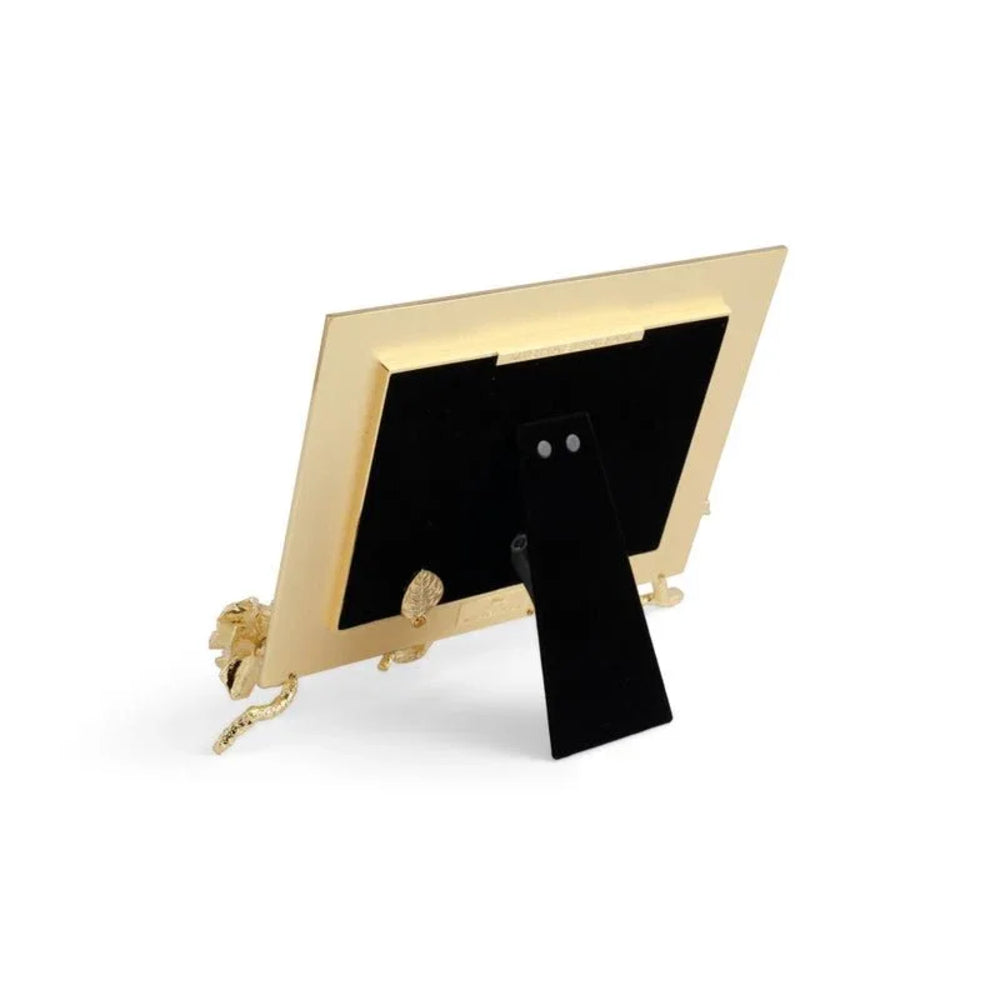 Gold photo frame with black mat on a white background