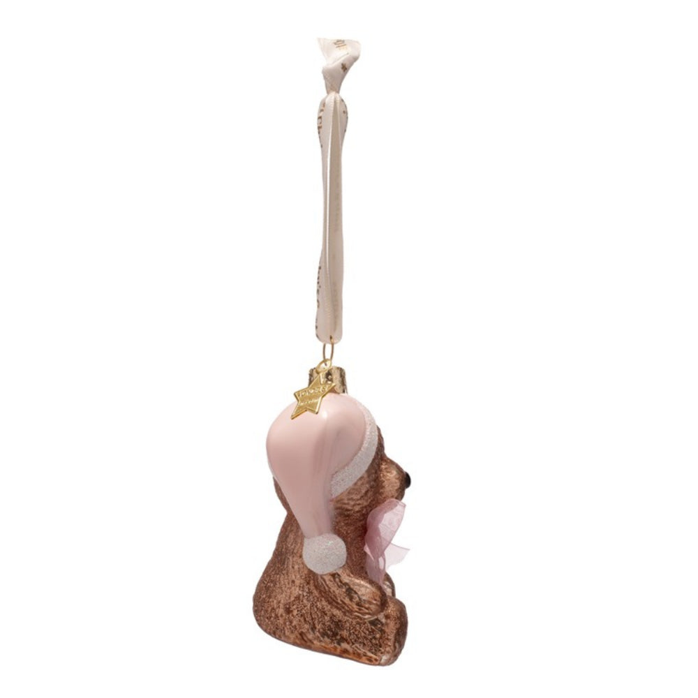 Decorative angel ornament with pink wings and gold accents on a white background