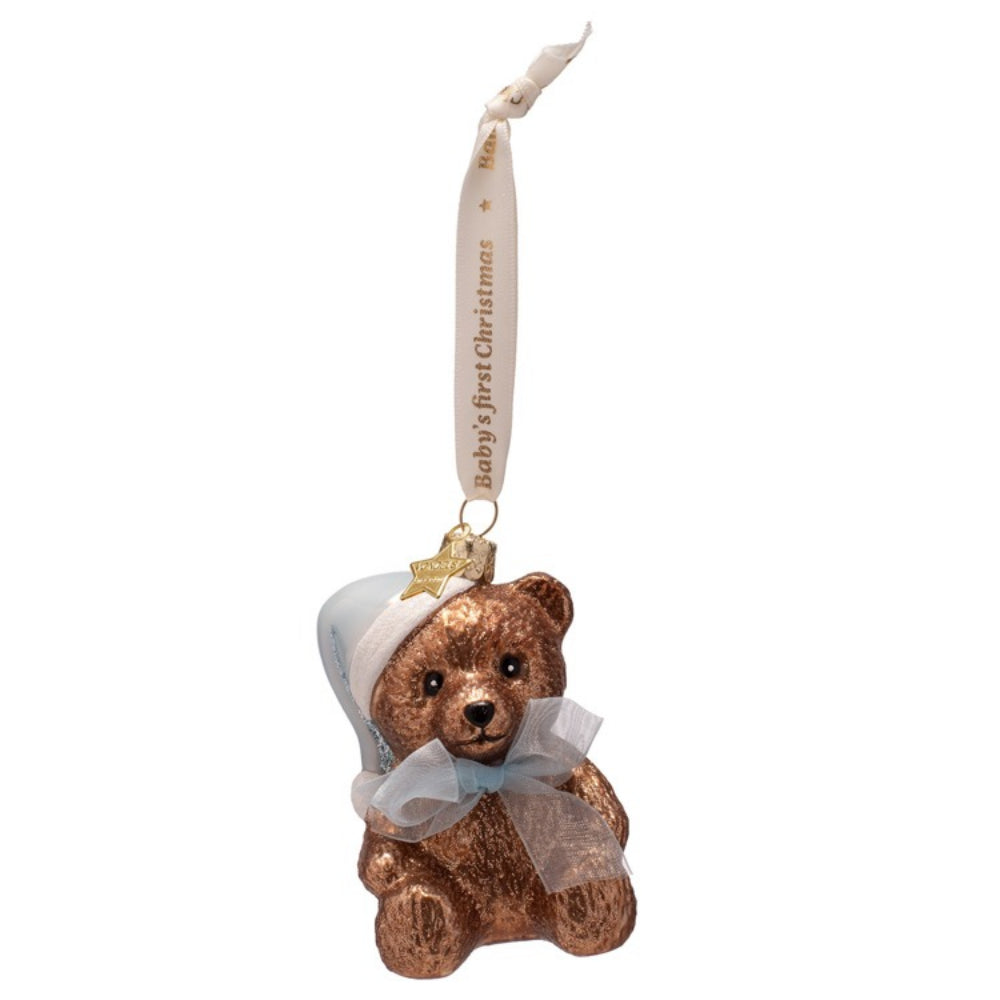 Decorative bear ornament with a ribbon on a white background