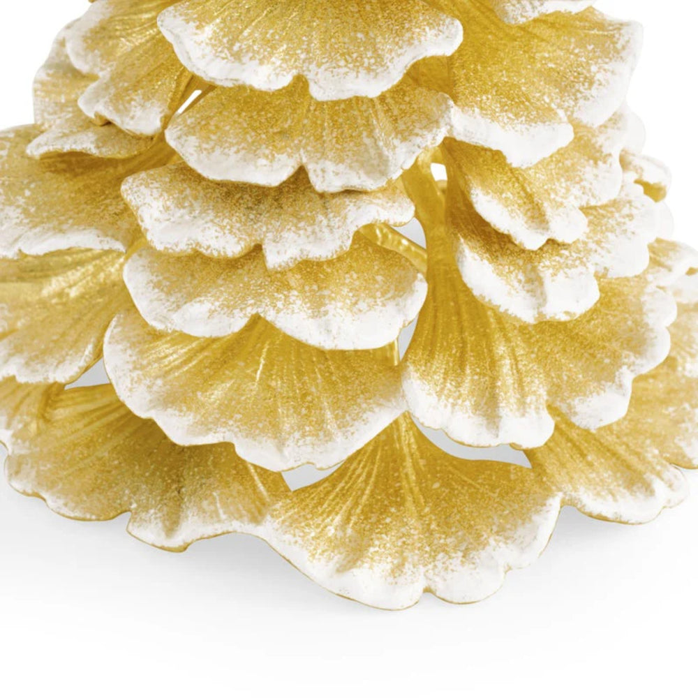Close-up of a textured gold tree on a white background