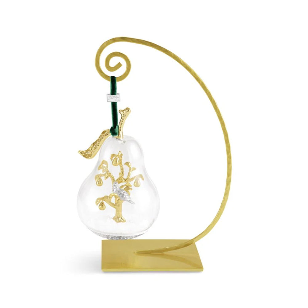 Decorative glass ornament with gold stand on a white background.