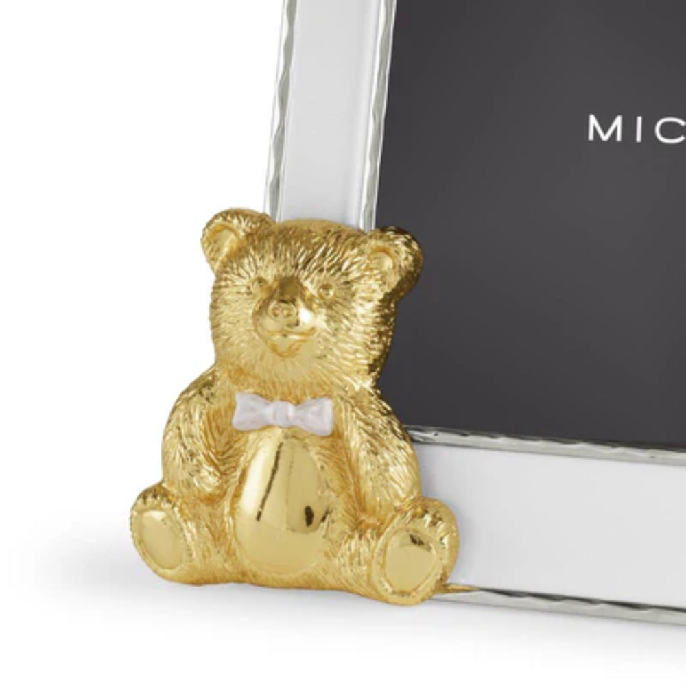 Gold teddy bear photo frame with a clear glass front on a white background