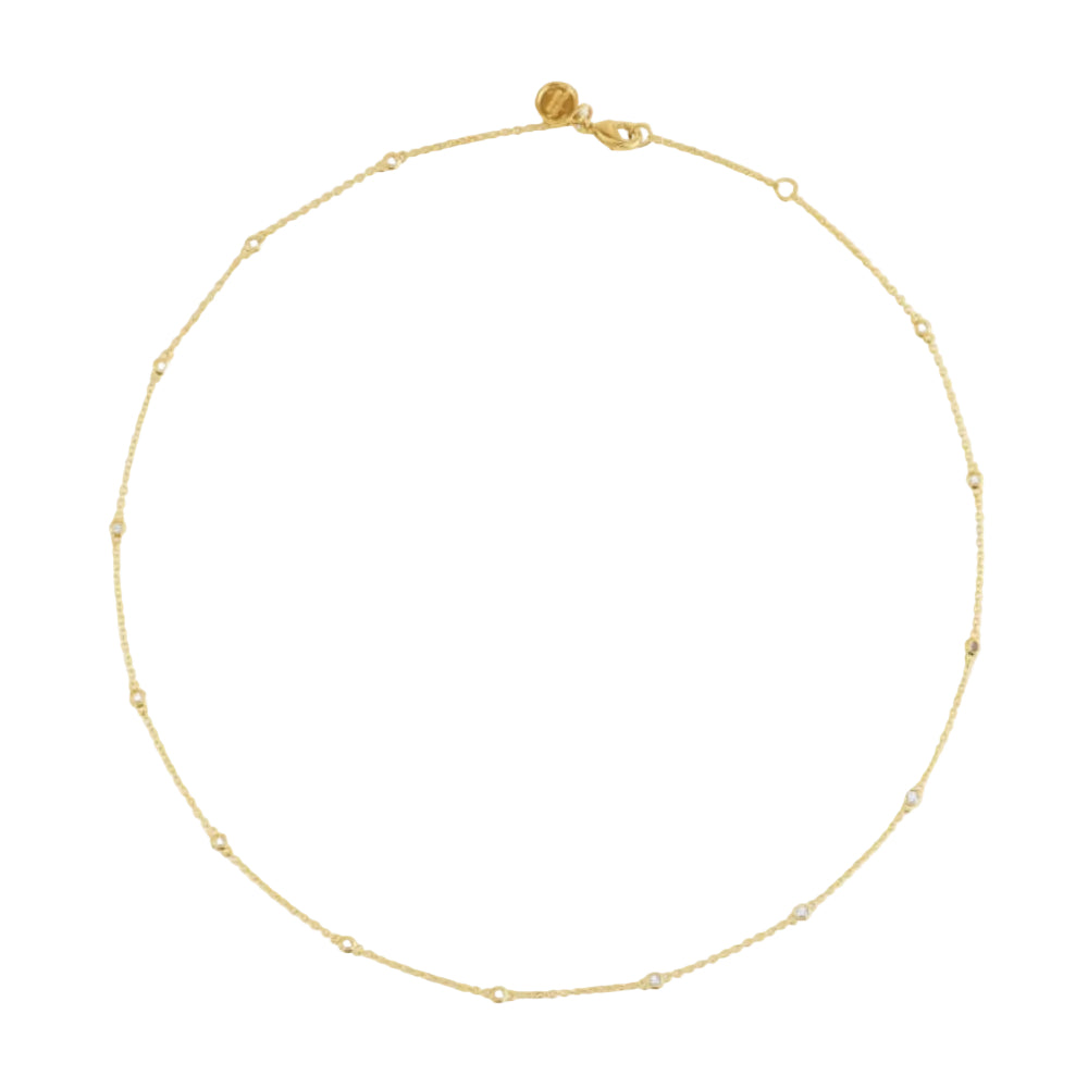 A delicate gold chain necklace with evenly spaced small bead links, displayed on a white background.