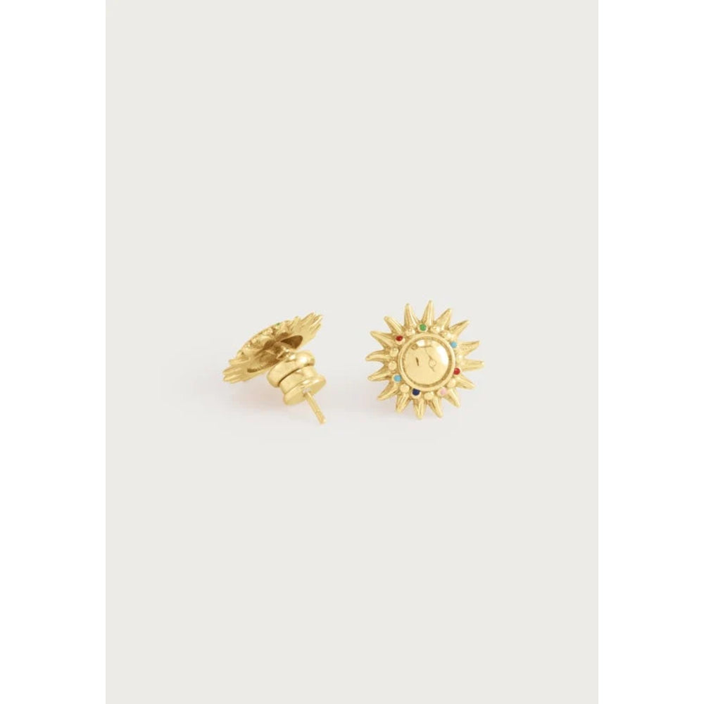 A pair of gold sun-shaped stud earrings, with one shown from the front displaying a sun face and the other from the side showing the post and backing, set against a light gray background.