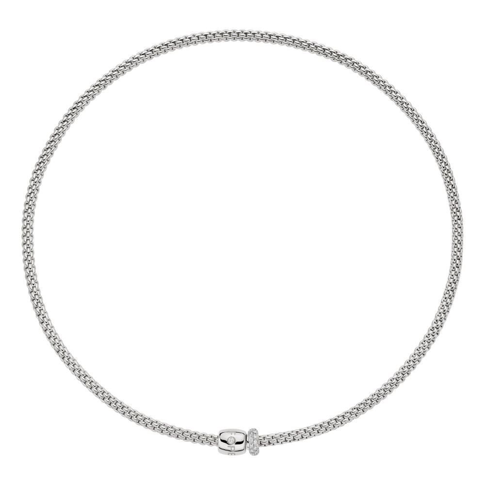 A silver-toned chain necklace with a small polished clasp, displayed in a circular shape against a plain white background.