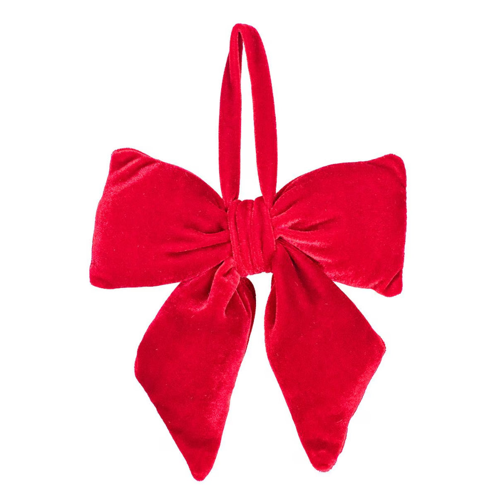Red velvet bow on a white background