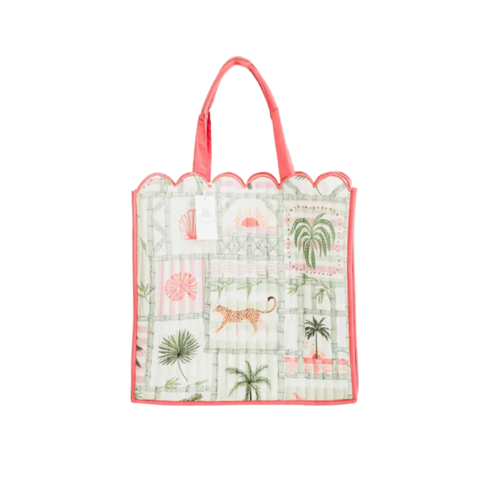 Pink and green multi pattern quilted tote bag on a white background
