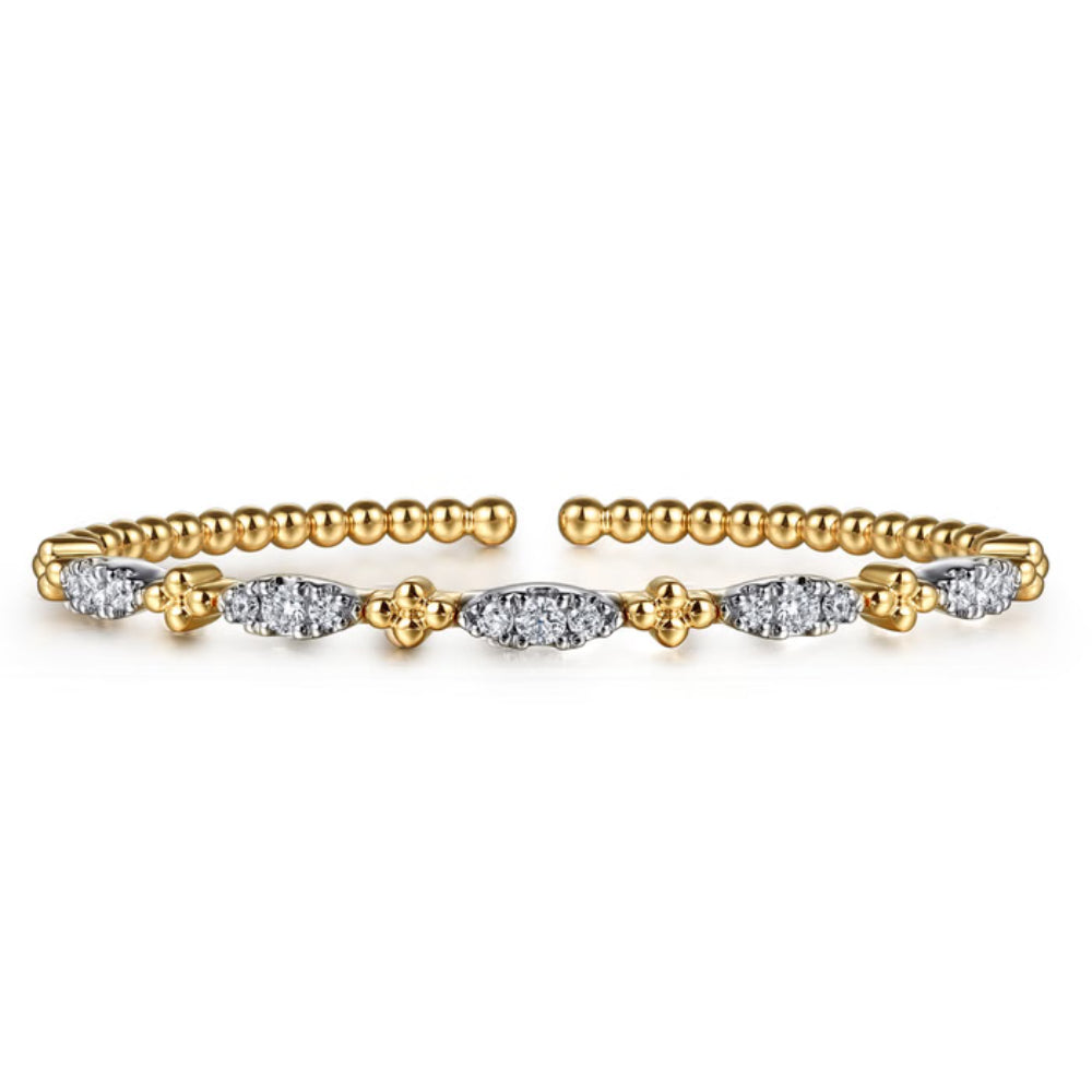 Gold and diamond bracelet on a white background