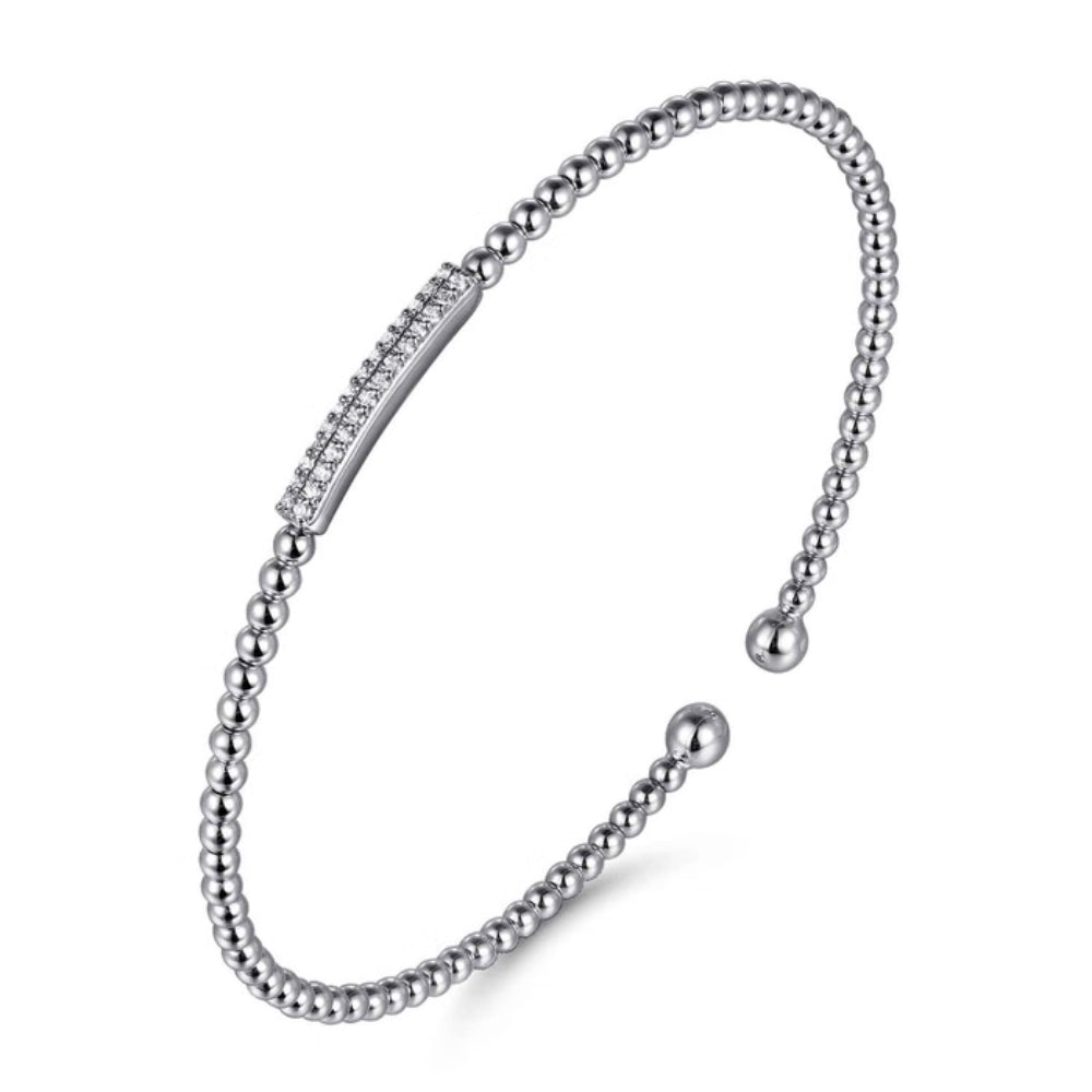 Gold bracelet with a chain and bead design on a white background