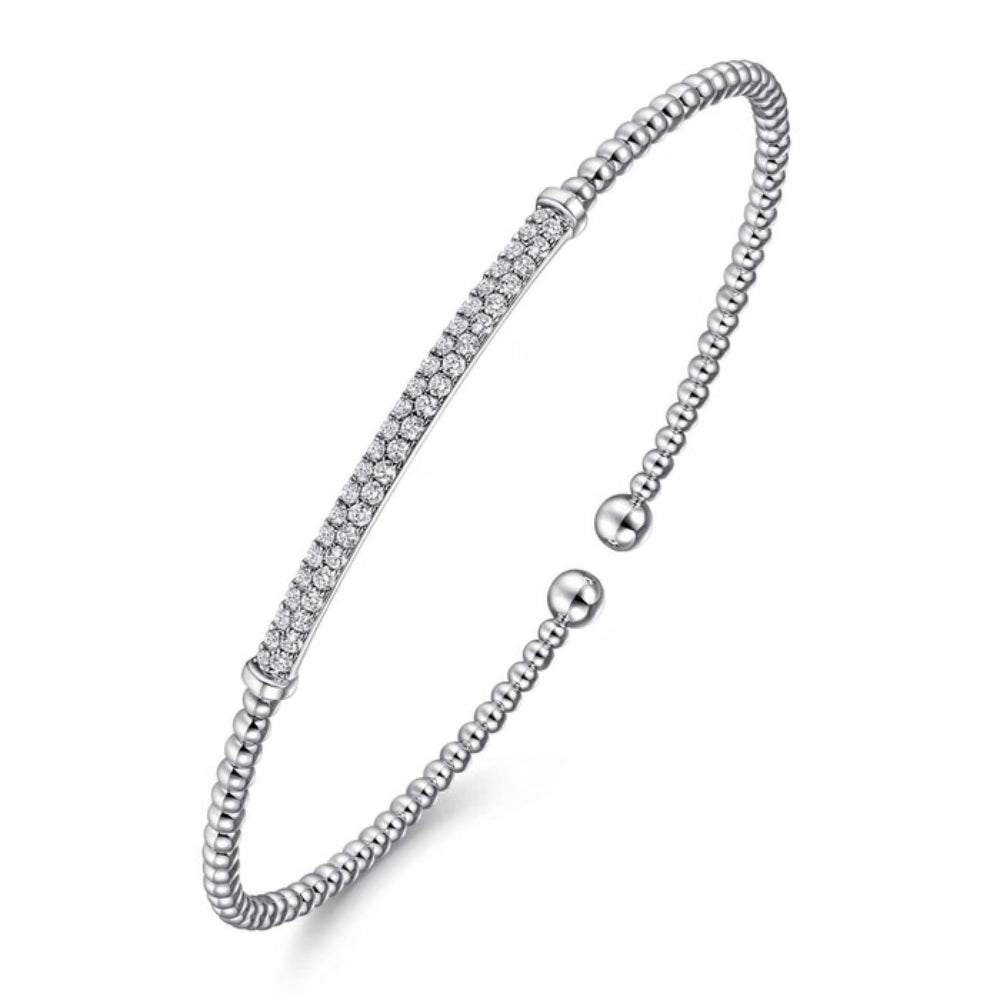 Silver bracelet with small beads on a white background