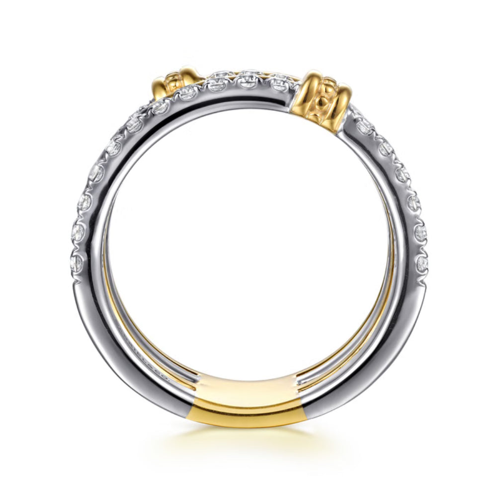 Two-tone gold and silver ring with diamond accents on a white background