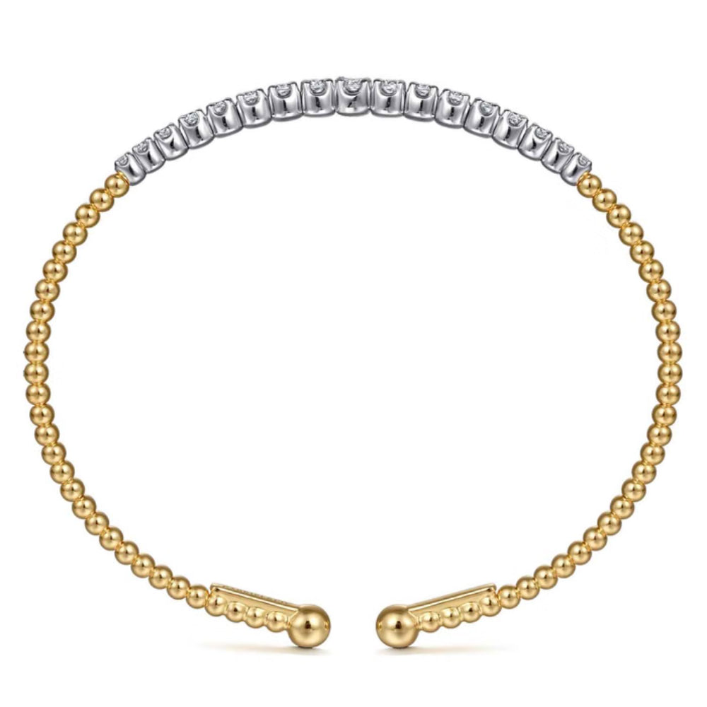 A two-tone gold and silver bangle bracelet with a beaded gold chain, a silver pavé-set row of round stones across the top, and matching gold ball-end closures on a plain white background.