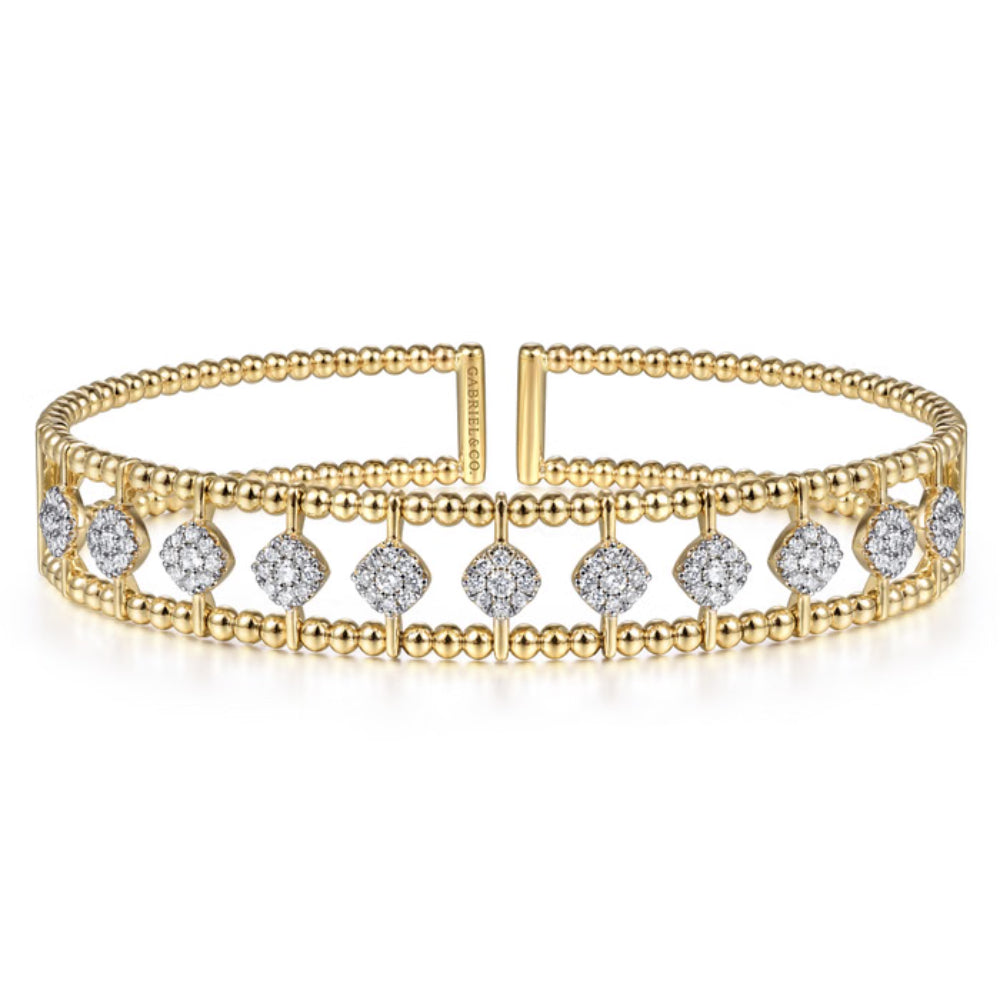 A gold beaded cuff bracelet featuring a row of pavé diamond accents, displayed on a clean white background.
