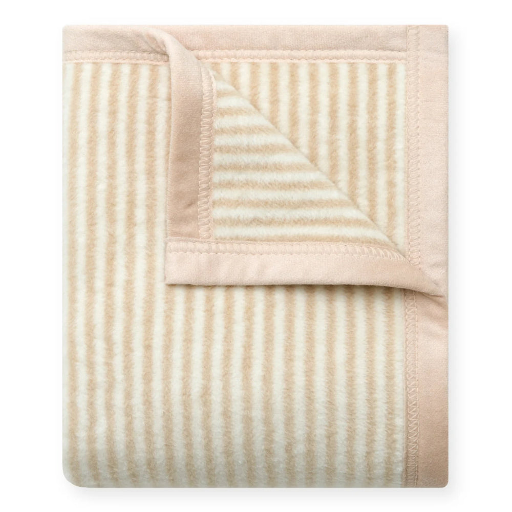 A folded baby blanket with vertical cream and beige stripes and a solid beige border, shown on a clean white background.