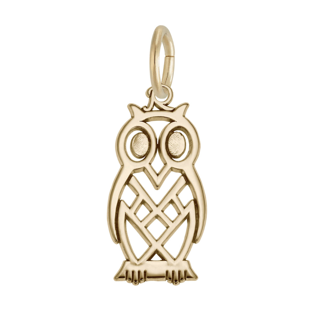 Gold owl charm on a white background