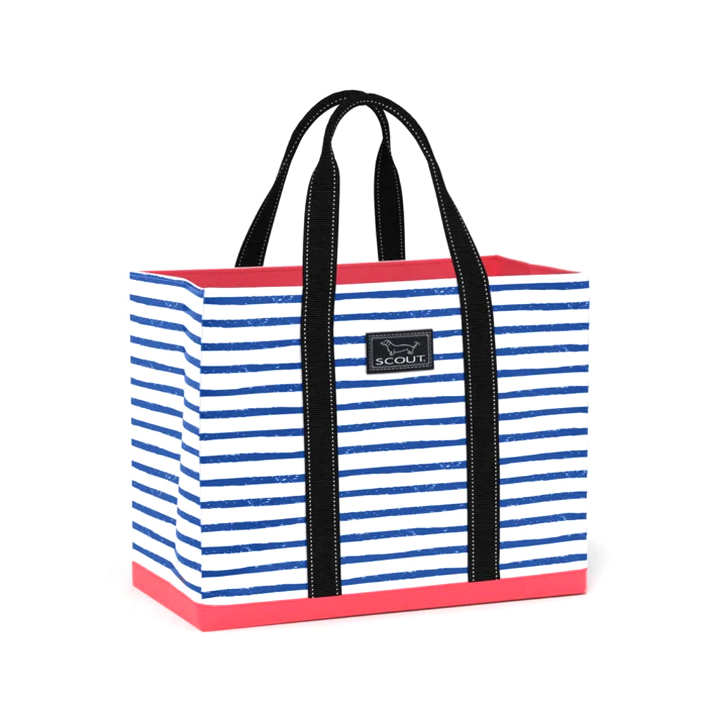 A striped tote bag with blue and white horizontal stripes, black handles, and a pink bottom trim, featuring a black Scout logo patch on the front.