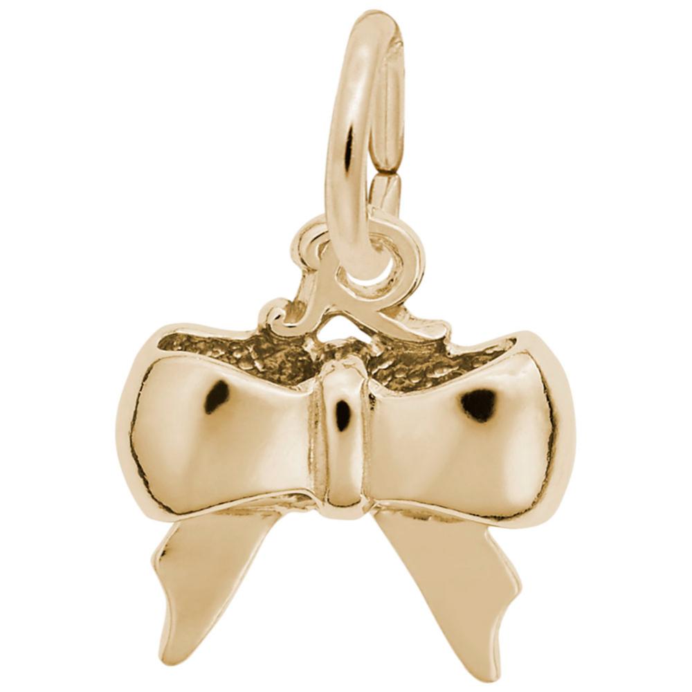 Gold bow-shaped charm on a white background