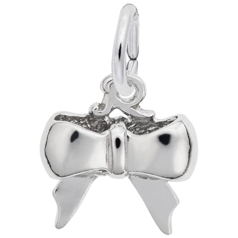 Silver bow-shaped charm on a white background