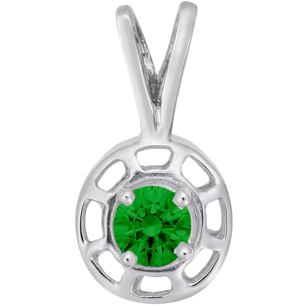 Round silver pendent with a green gemstone on a white background 