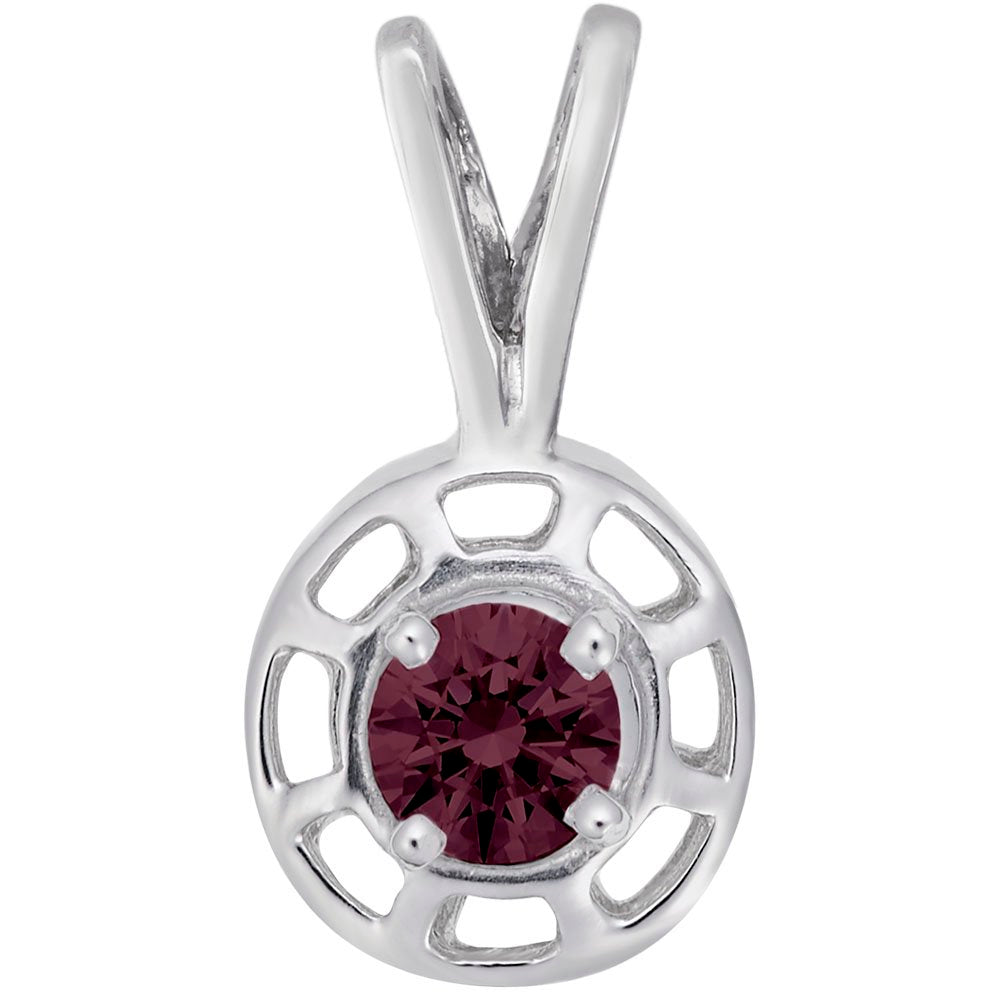 Round silver pendent with a red gemstone on a white background 
