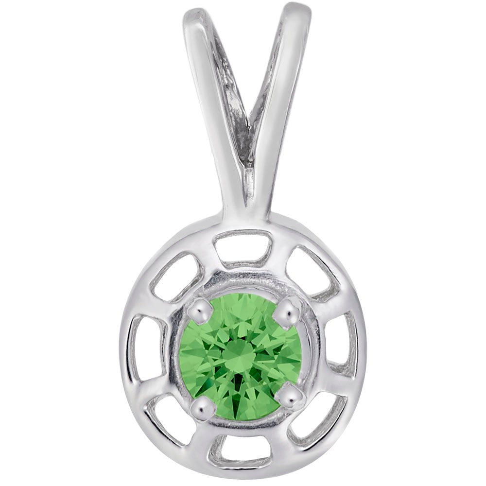 Round silver pendent with a green gemstone on a white background 