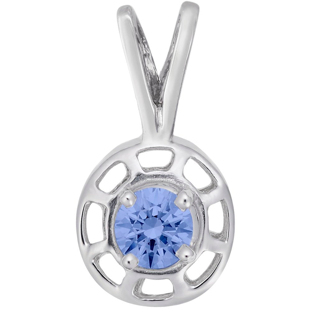 Round silver pendent with a blue gemstone on a white background 