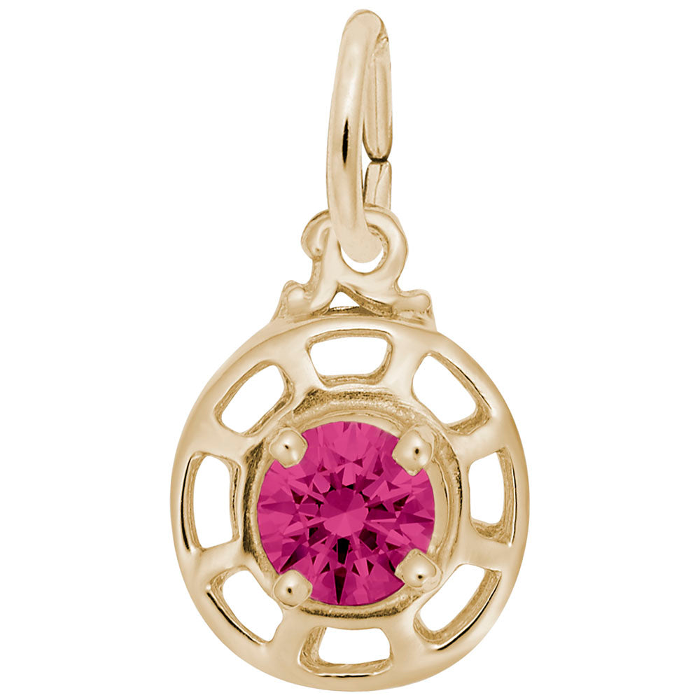 Gold charm with a pink gemstone on a white background