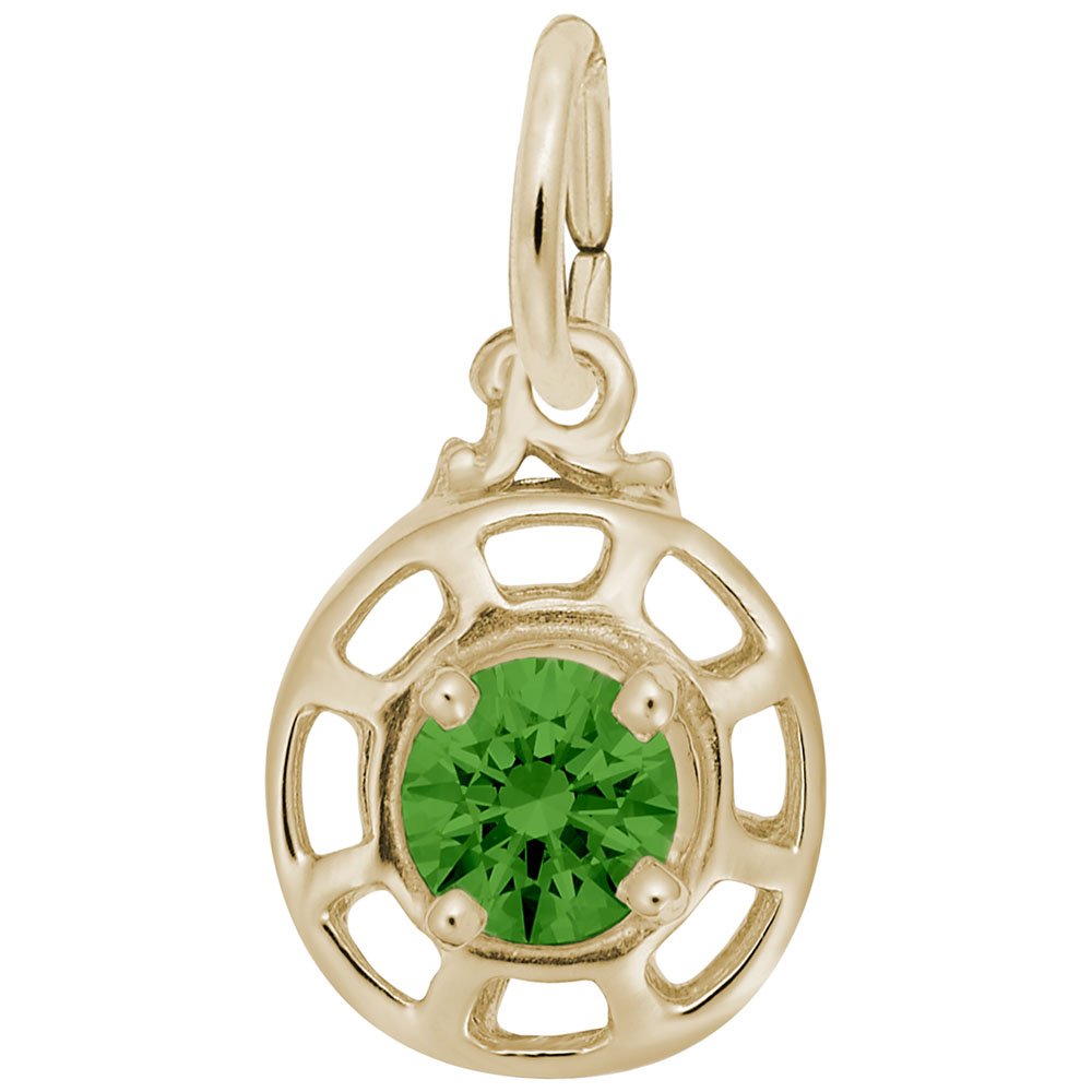 Gold charm with a green gemstone on a white background