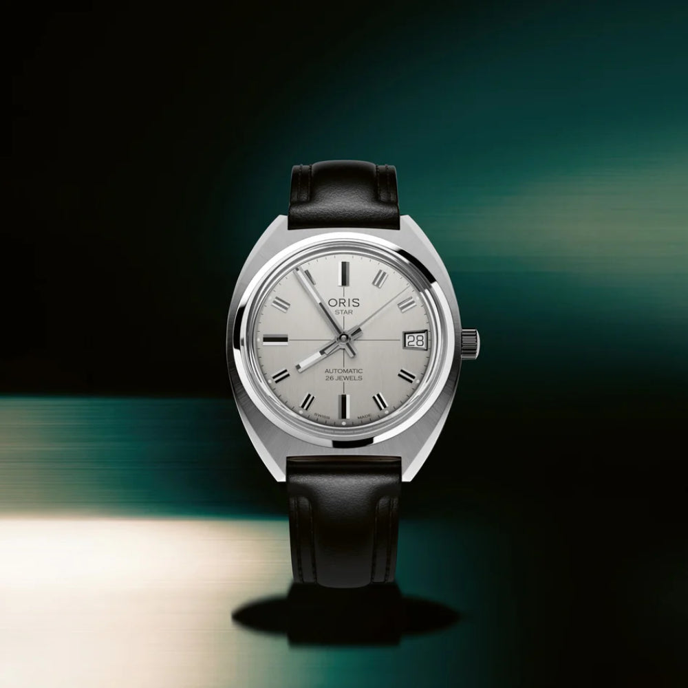 Oris watch with black leather strap on a gradient background
