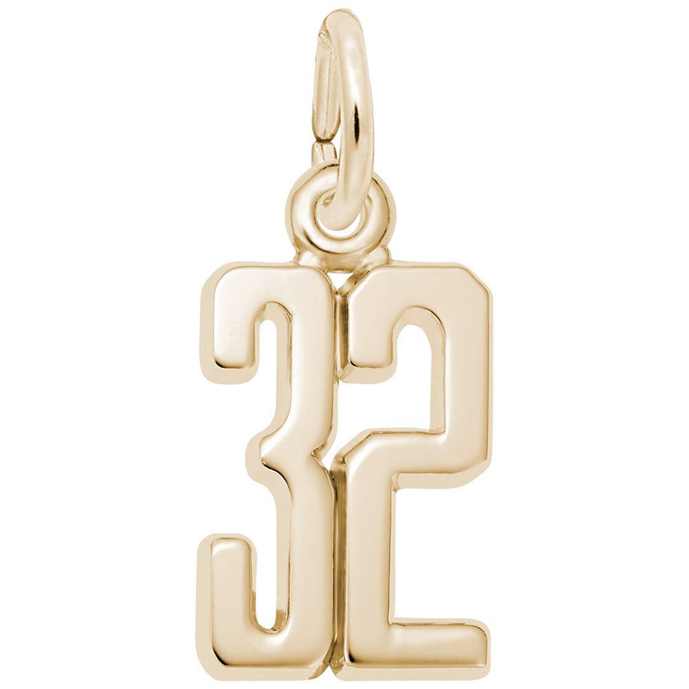 Gold number '32' charm on a white background