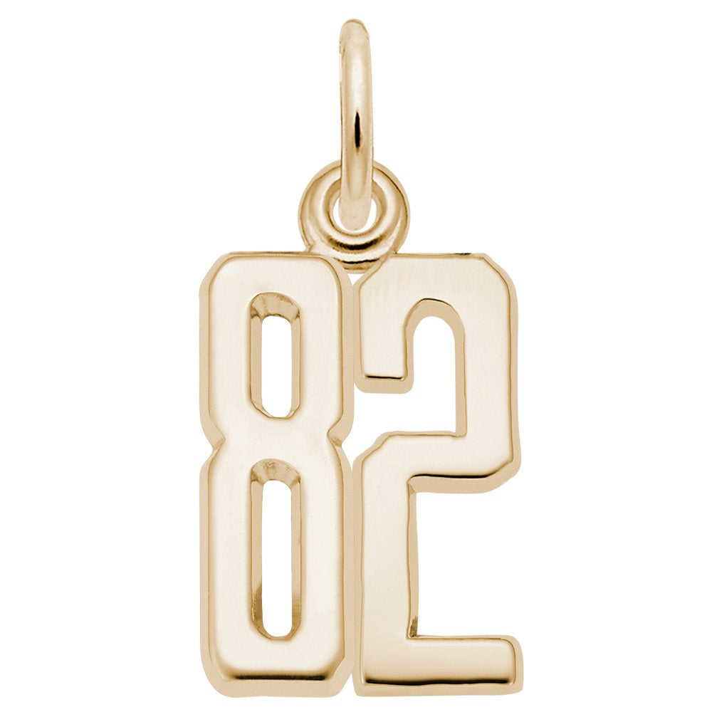 Gold number '82' charm on a white background