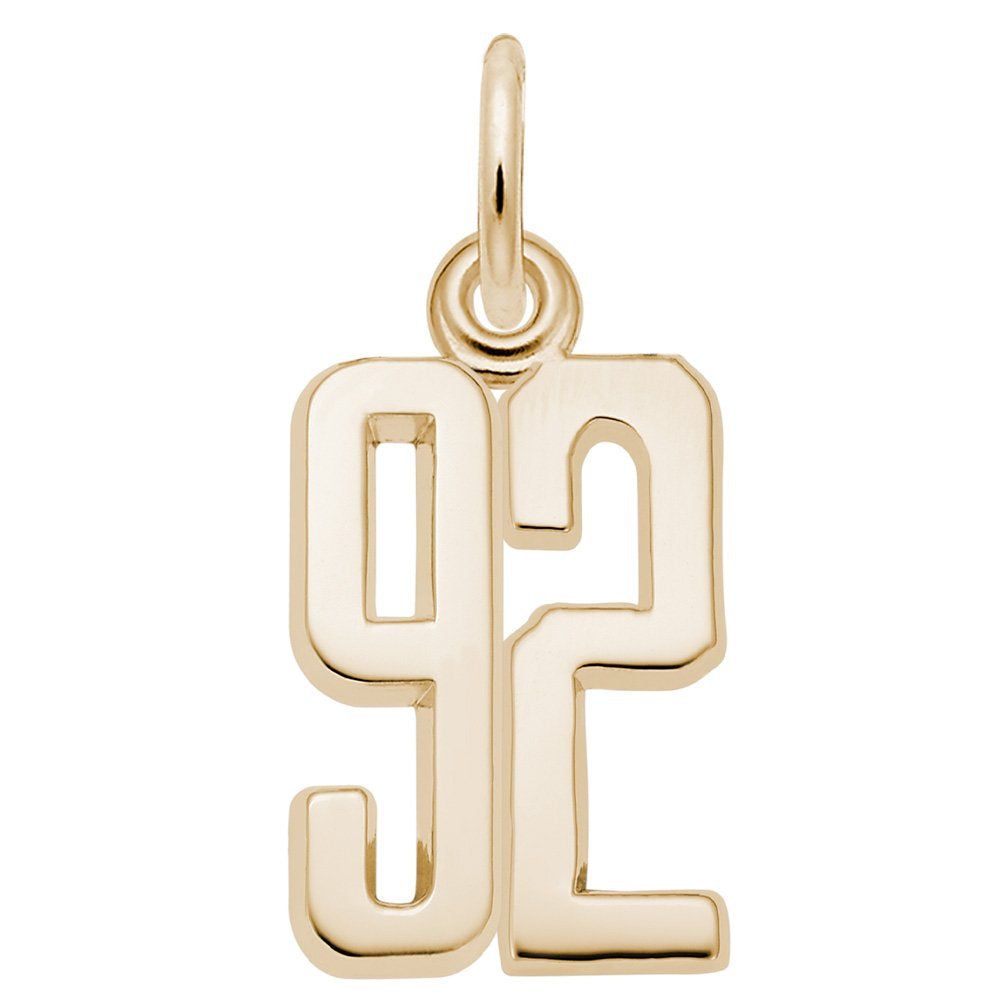 Gold number '92' charm on a white background